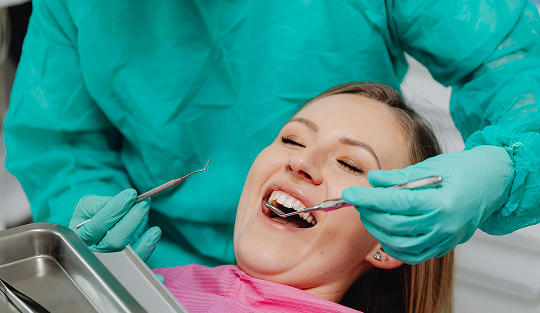 Dentist treating patient